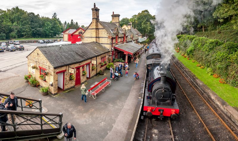 Tourists waiting at Haverthwaite Station part of Lakeside and Haverthwaite Railway. 4 image panorama: Haverthwaite, Cumbria, England, UK. October 4, 2016.